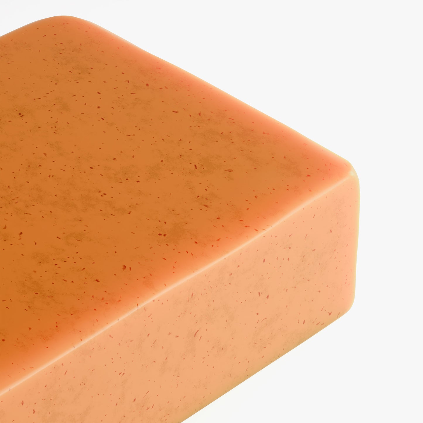 Angled view of Kojic Acid & Turmeric Soap bar highlighting natural texture and ingredients